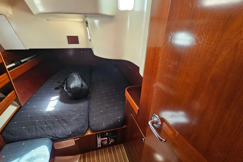 Slide: The Image of Cozy cabin interior of 1996 Beneteau Oceanis 440 sailboat with wooden finish. - 33