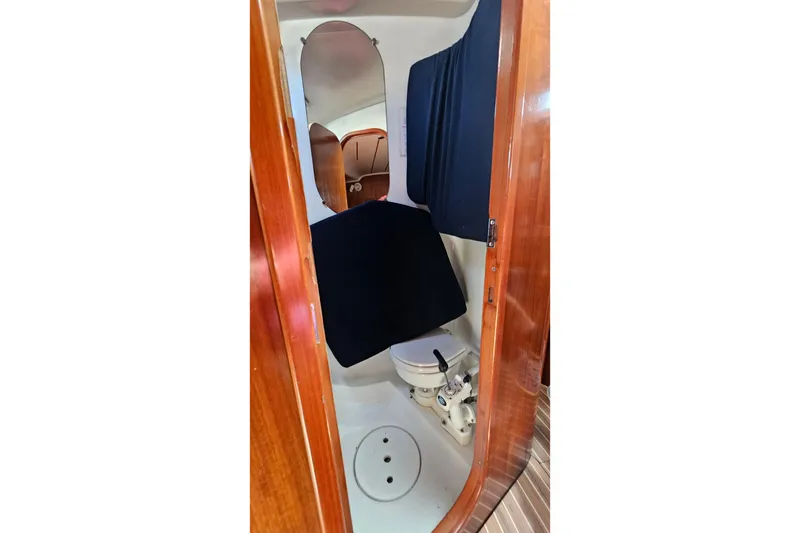 Slide: The Image of Interior view of 1996 Beneteau Oceanis 440 yacht bathroom with wooden finish. - 39