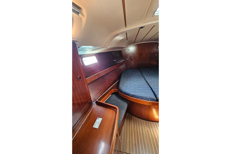 Slide: The Image of Cozy cabin interior of 1996 Beneteau Oceanis 440 sailboat with wooden furnishings. - 45