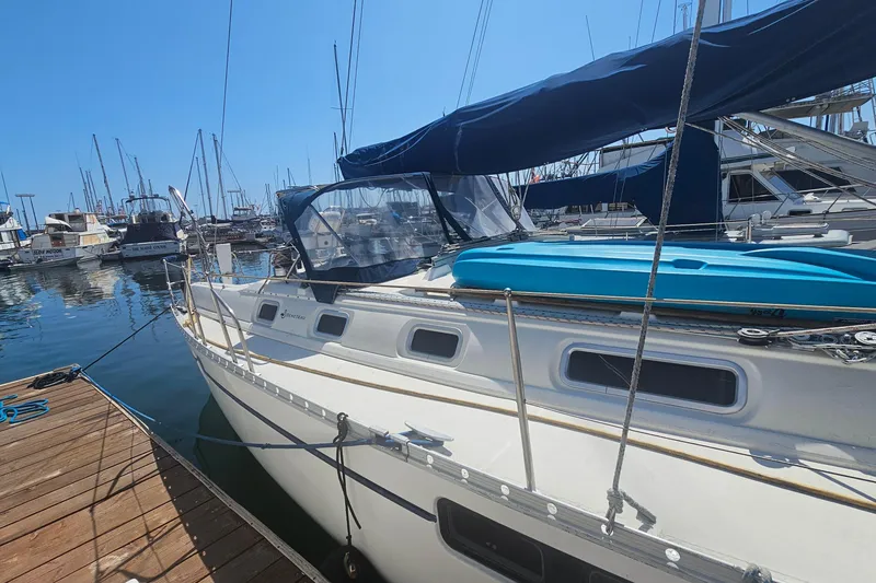Slide: The Image of Beneteau Oceanis 440 sailboat docked at marina, 1996 model, sunny day. - 5