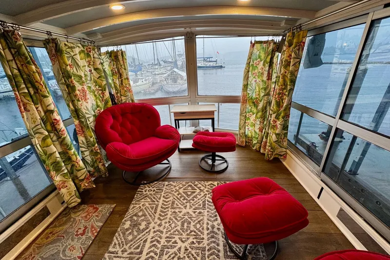 Slide: The Image of Luxurious 1970 Chris-Craft Commander 42 interior with vibrant red seating and floral curtains. - 14