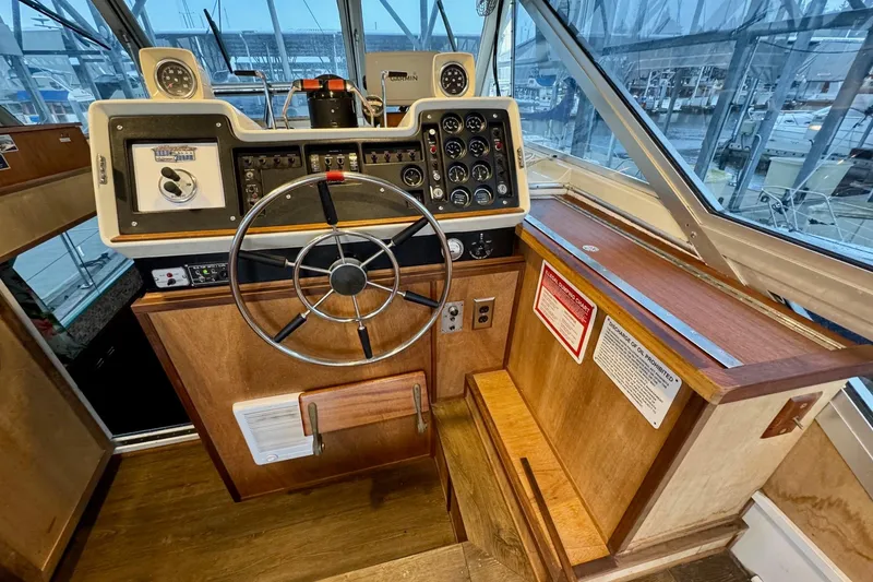 Slide: The Image of Helm of 1970 Chris-Craft Commander 42 with vintage controls and steering wheel. - 19