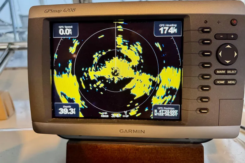 Slide: The Image of Garmin GPSmap 4208 displaying navigation data on a 1970 Chris-Craft Commander 42. - 23