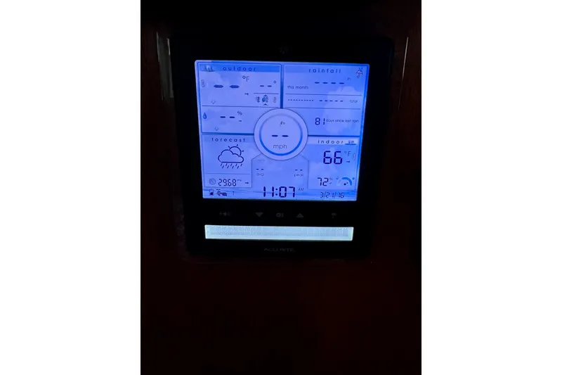 Slide: The Image of Digital weather display on 1970 Chris-Craft Commander 42 boat, showing temperature and forecast. - 26