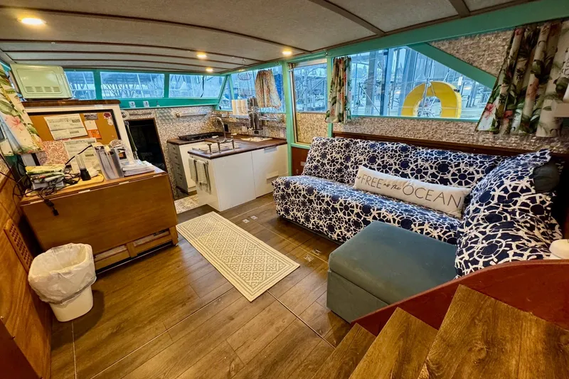 Slide: The Image of 1970 Chris-Craft Commander 42 interior with cozy seating, kitchenette, and nautical decor. - 32