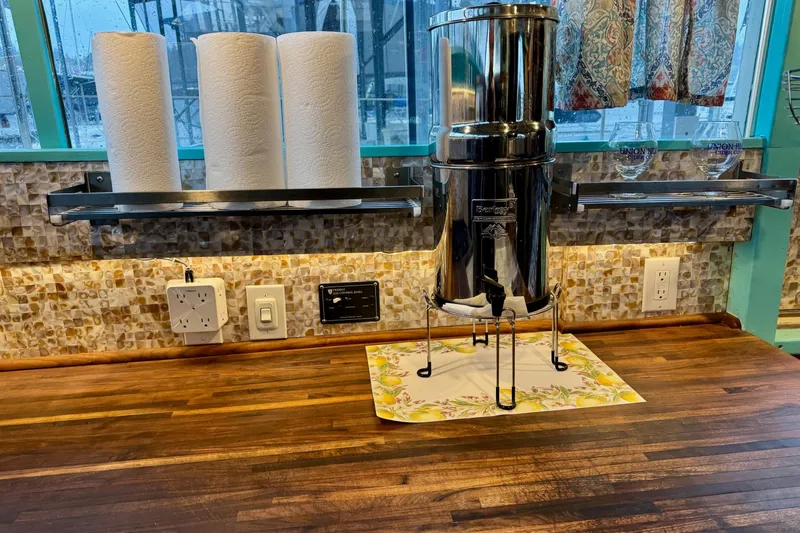 Slide: The Image of 1970 Chris-Craft Commander 42 kitchen with water filter and paper towel holder. - 40