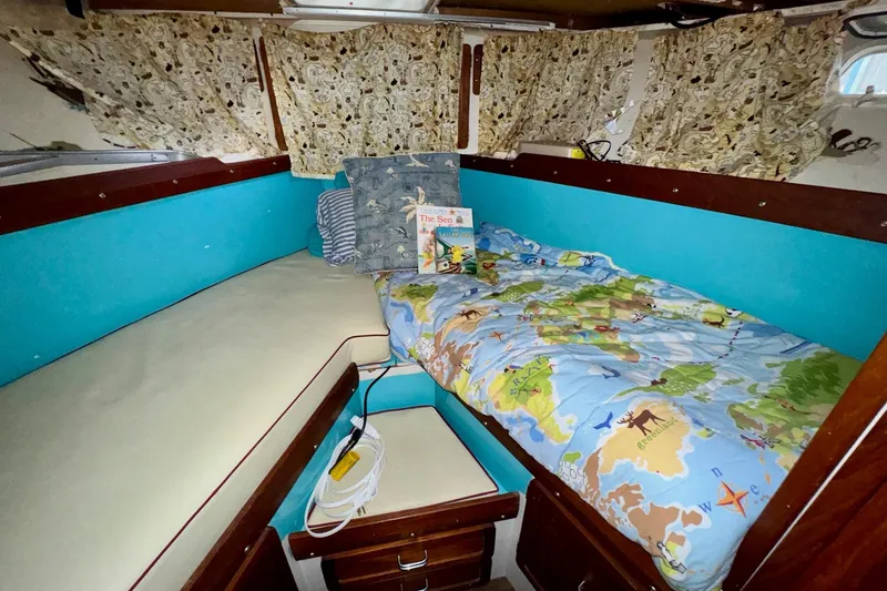 Slide: The Image of 1970 Chris-Craft Commander 42 cabin with colorful bedding and nautical decor. - 56