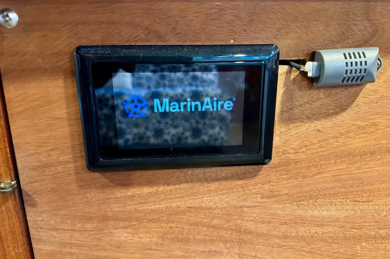 Slide: The Image of MarinAire display on 1970 Chris-Craft Commander 42 boat, mounted on wooden panel. - 60