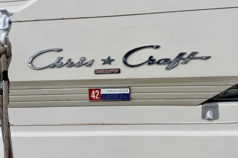 Slide: The Image of 1970 Chris-Craft Commander 42 boat emblem with fiberglass styling details. - 65