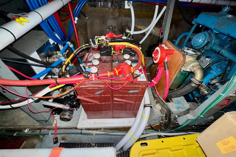 Slide: The Image of Engine room of a 1970 Chris-Craft Commander 42 with battery and wiring. - 70