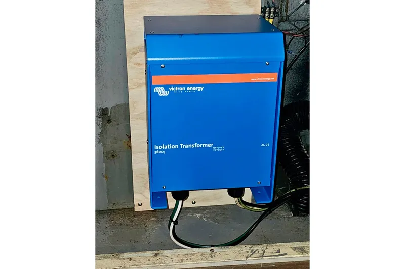 Slide: The Image of Blue Victron Energy isolation transformer installed on a 1970 Chris-Craft Commander 42. - 73