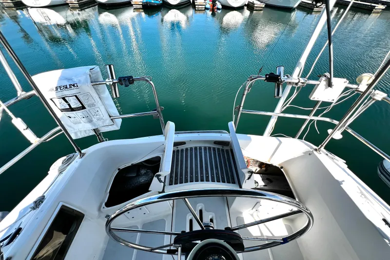 Slide: The Image of Cockpit view of 1989 Hunter Vision 32 sailboat docked in marina. - 32