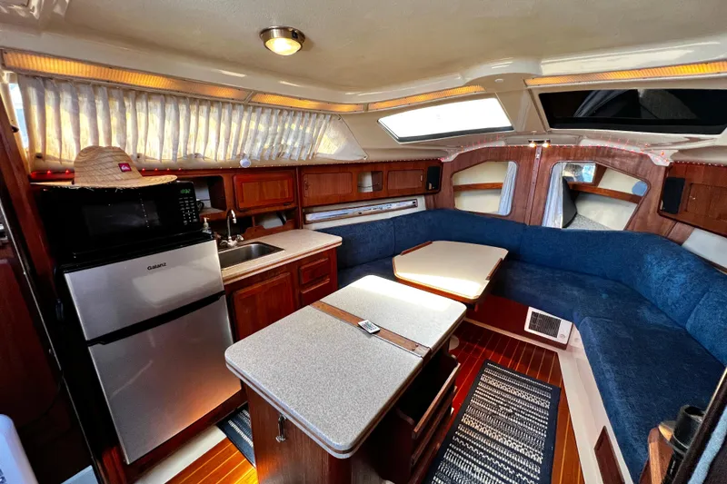Slide: The Image of Interior of 1989 Hunter Vision 32 sailboat with kitchen and seating area. - 41