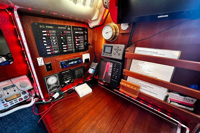 Slide: The Image of Control panel of 1989 Hunter Vision 32 sailboat with navigation and communication equipment. - 44
