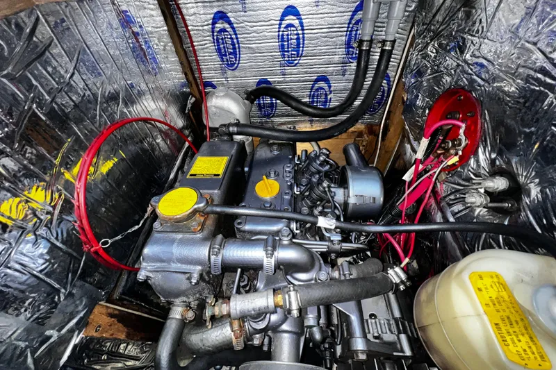 Slide: The Image of Engine compartment of a 1989 Hunter Vision 32 sailboat, showing detailed components and wiring. - 60