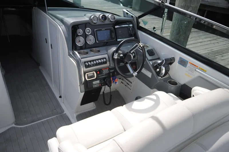 Slide: The Image of 2015 Formula 310 Bowrider cockpit with steering wheel and control panel. - 12
