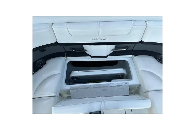 Slide: The Image of 2015 Formula 310 Bowrider interior seating with storage compartment open. - 16