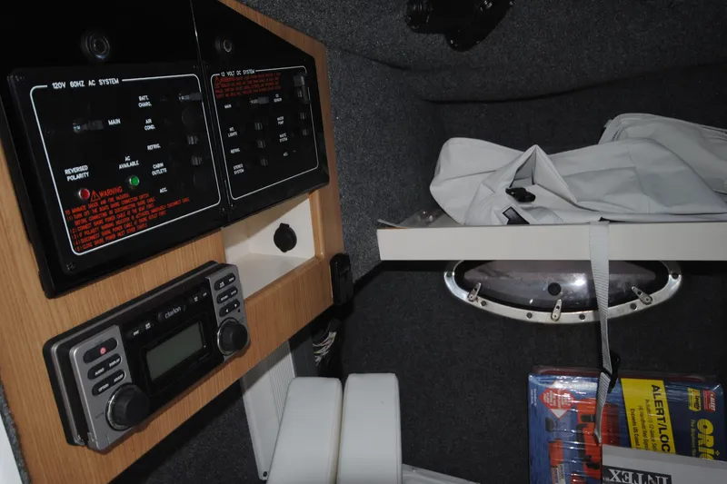 Slide: The Image of 2015 Formula 310 Bowrider cabin interior with control panels and storage area. - 22