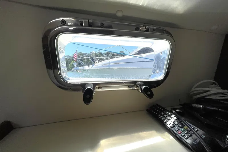 Slide: The Image of 1999 Legacy Yachts 40 Sedan cruising at sunset on open water. - 104