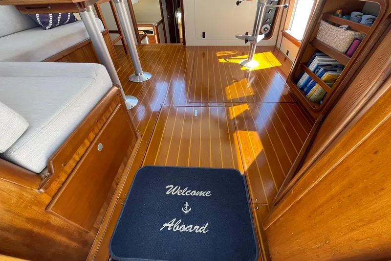 Slide: The Image of 1999 Legacy Yachts 40 Sedan galley with wood accents, microwave, and stainless steel sink. - 40