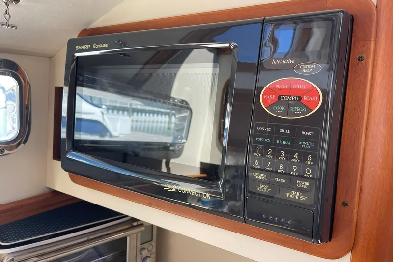 Slide: The Image of Sharp Carousel microwave in 1999 Legacy Yachts 40 Sedan kitchen area. - 46