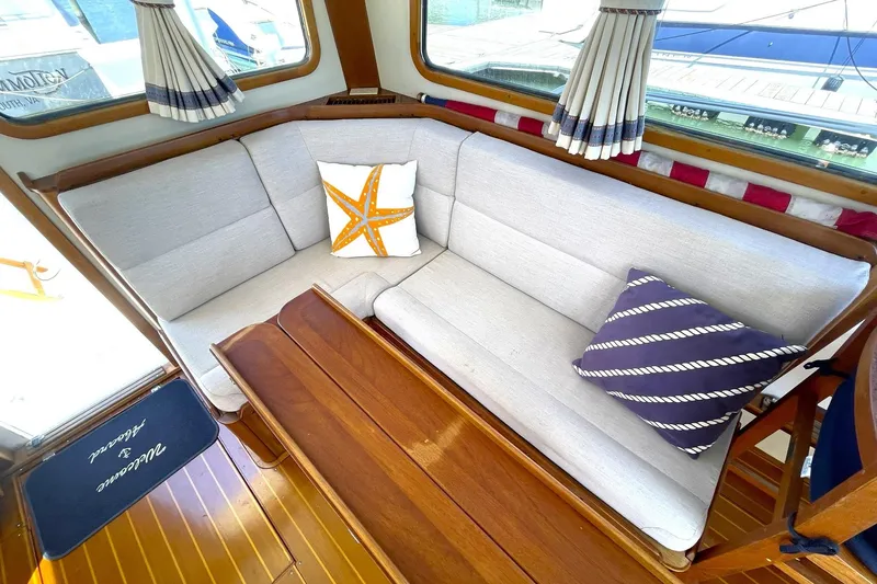 Slide: The Image of Pantry shelves on a 1999 Legacy Yachts 40 Sedan, stocked with various food items. - 47