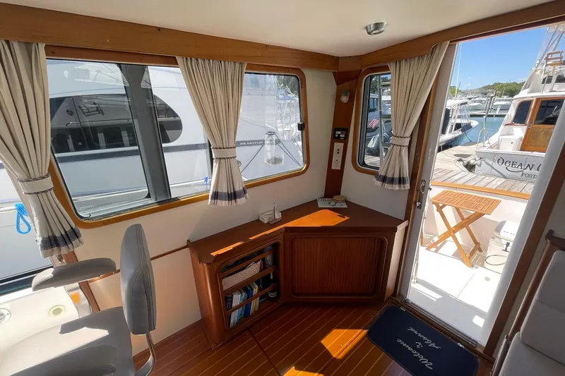 Slide: The Image of Electrical panel inside 1999 Legacy Yachts 40 Sedan, featuring control switches and gauges. - 48