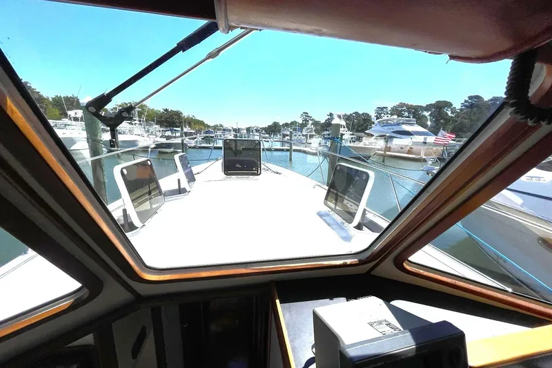 Slide: The Image of 1999 Legacy Yachts 40 Sedan view from cabin, docked in a marina. - 59