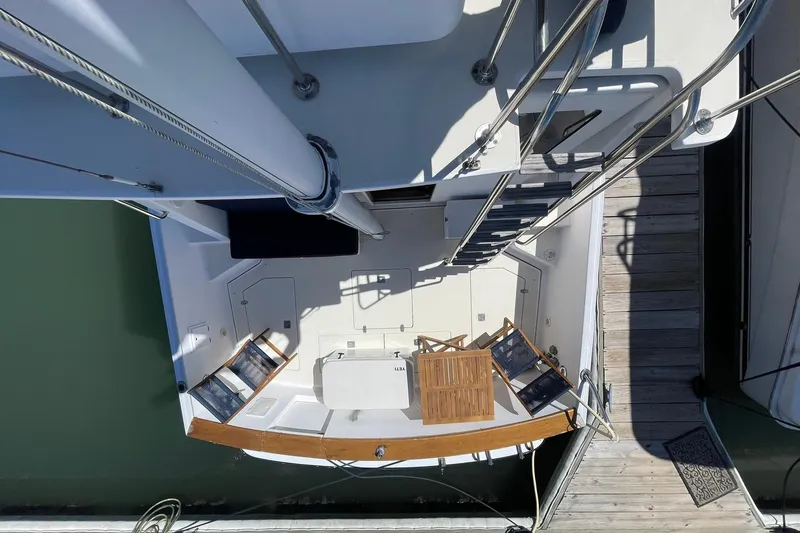 Slide: The Image of Overhead view of 1999 Legacy Yachts 40 Sedan deck with chairs and table. - 65