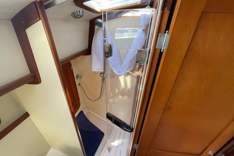 Slide: The Image of Engine of 1999 Legacy Yachts 40 Sedan, showcasing detailed mechanical components. - 73
