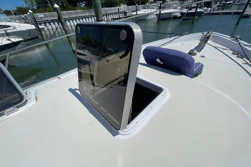 Slide: The Image of Open hatch on 1999 Legacy Yachts 40 Sedan, docked at marina. - 84