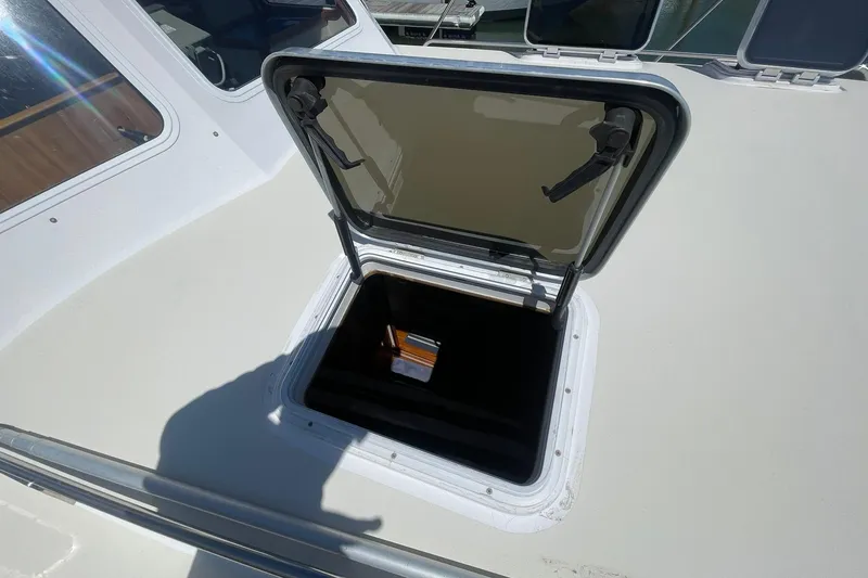 Slide: The Image of Open hatch on 1999 Legacy Yachts 40 Sedan, showcasing deck access. - 87
