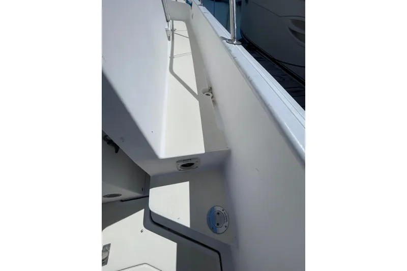 Slide: The Image of 1999 Legacy Yachts 40 Sedan deck view with railing and fittings. - 90
