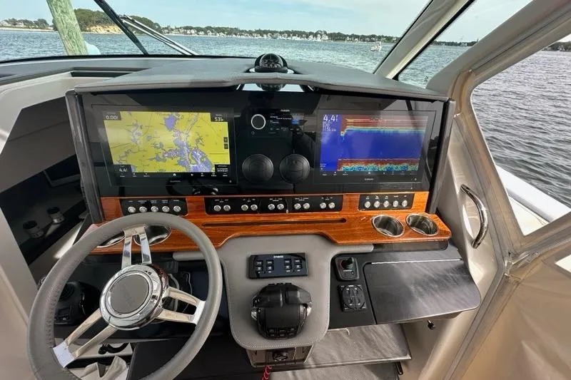 Slide: The Image of 2021 Tiara Sport 43 LS helm with advanced navigation displays and controls. - 21