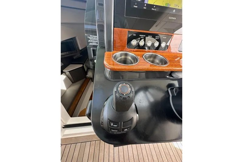 Slide: The Image of 2021 Tiara Sport 43 LS helm with joystick control and navigation display. - 23