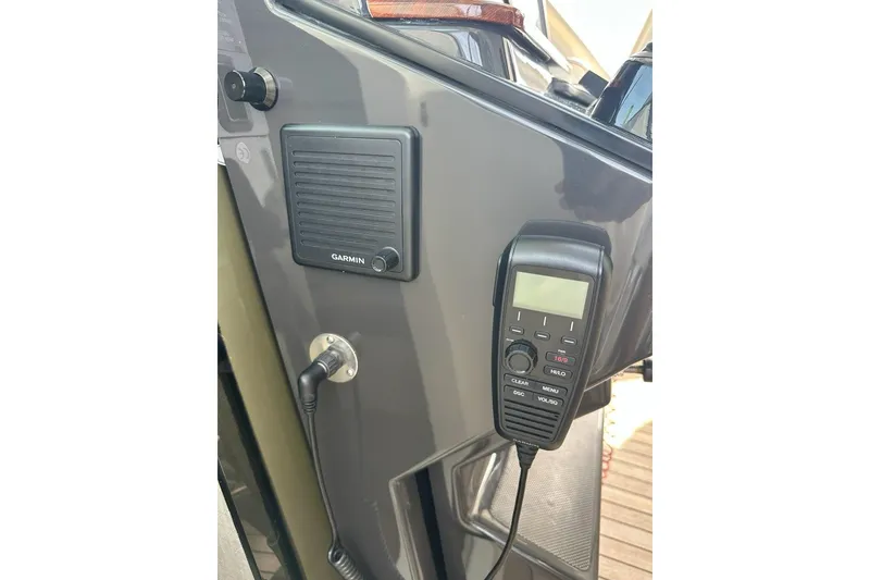Slide: The Image of 2021 Tiara Sport 43 LS boat dashboard with Garmin marine radio equipment. - 26