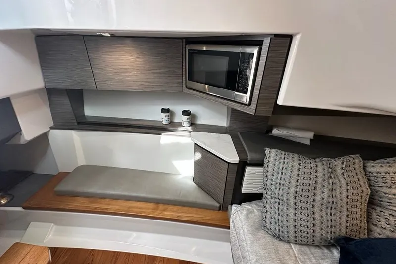 Slide: The Image of Interior of 2021 Tiara Sport 43 LS yacht with modern kitchenette and seating area. - 31