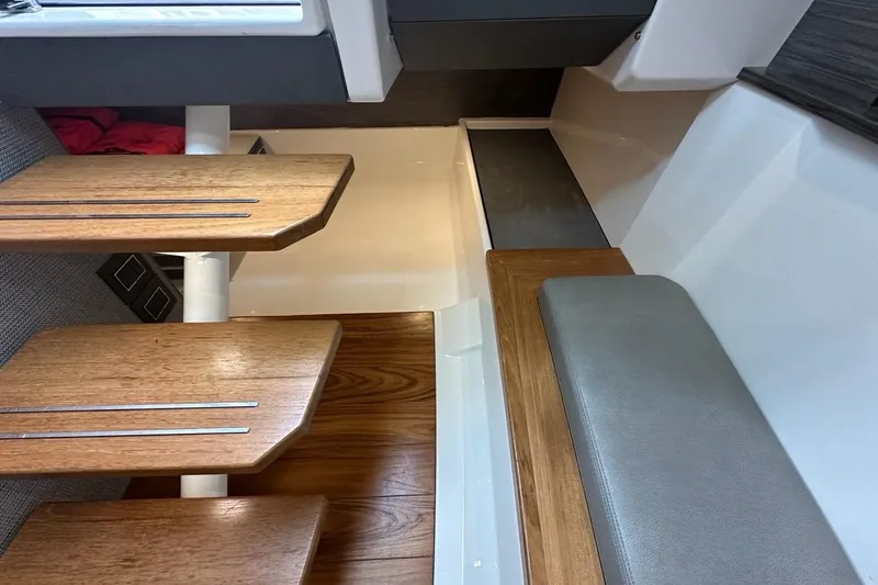 Slide: The Image of Interior of 2021 Tiara Sport 43 LS yacht with wooden steps and seating. - 34