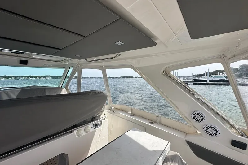 Slide: The Image of Interior view of 2021 Tiara Sport 43 LS yacht with scenic water backdrop. - 48
