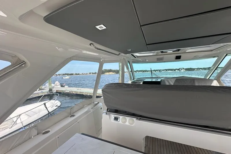 Slide: The Image of Interior view of 2021 Tiara Sport 43 LS yacht with scenic waterfront backdrop. - 49