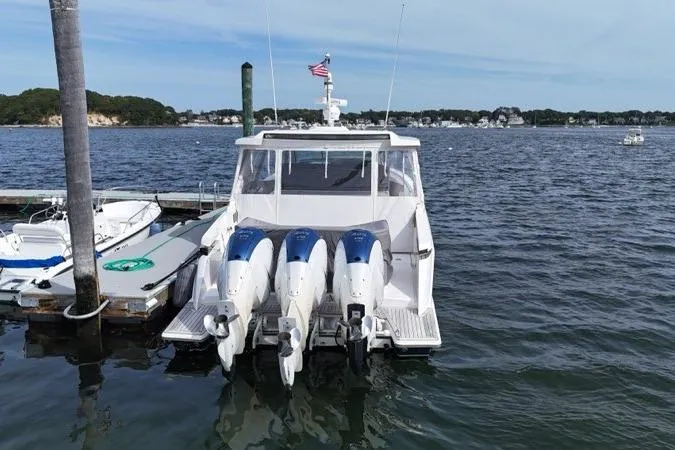Slide: The Image of Triple Yamaha 425 V8 engines on a 2021 Tiara Sport 43 LS boat. - 7