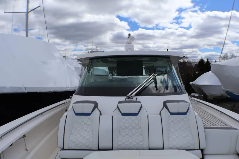 Slide: The Image of 2021 Tiara Sport 43 LS boat with sleek design and modern seating. - 76