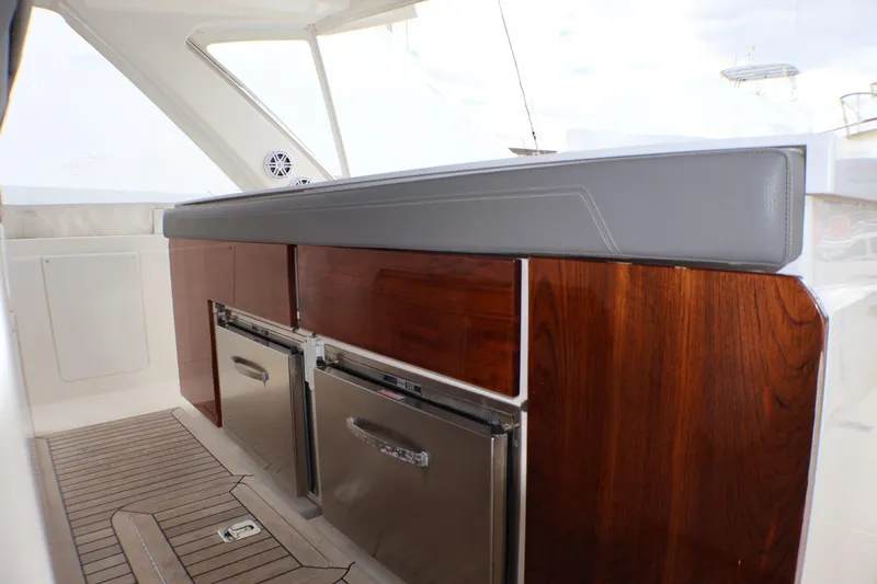 Slide: The Image of Luxurious interior of 2021 Tiara Sport 43 LS yacht with wood cabinetry and stainless steel appliances. - 80