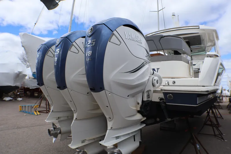 Slide: The Image of 2021 Tiara Sport 43 LS with triple Yamaha 425 V8 outboard engines. - 89
