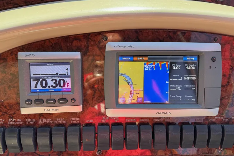 Slide: The Image of Garmin navigation displays on 2000 Sea Ray 380 Sundancer boat dashboard. - 10
