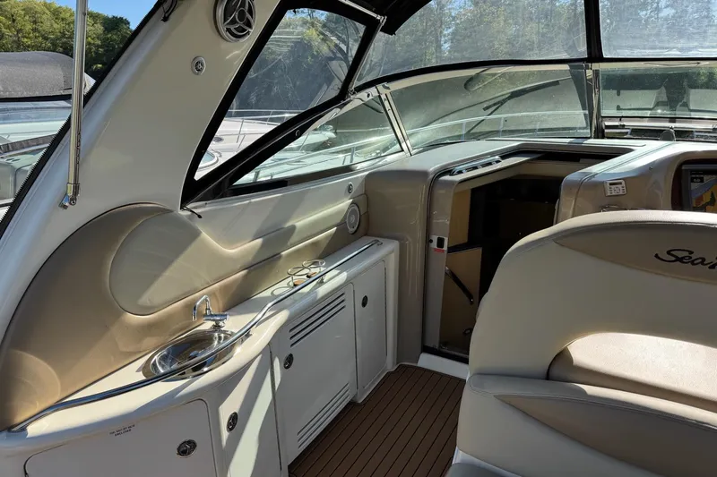 Slide: The Image of Interior of 2000 Sea Ray 380 Sundancer yacht with helm and seating area. - 11
