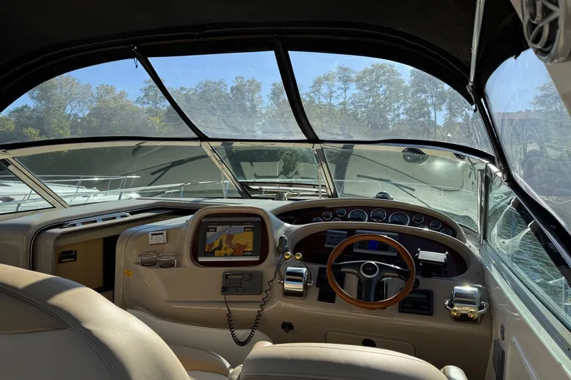 Slide: The Image of Interior view of 2000 Sea Ray 380 Sundancer boat cockpit with navigation equipment. - 7