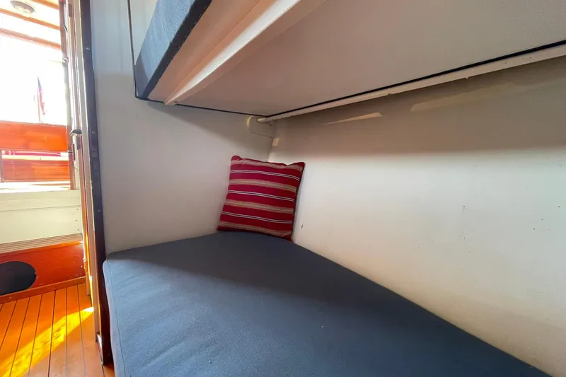 Slide: The Image of Cozy cabin interior of 1939 Richardson 26 Little Giant boat with striped pillow. - 10