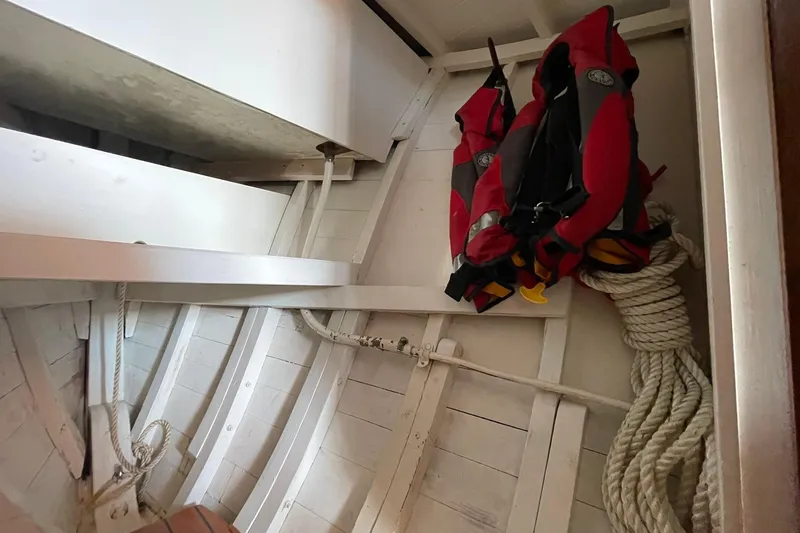 Slide: The Image of Interior of 1939 Richardson 26 Little Giant boat with life jackets and coiled rope. - 12