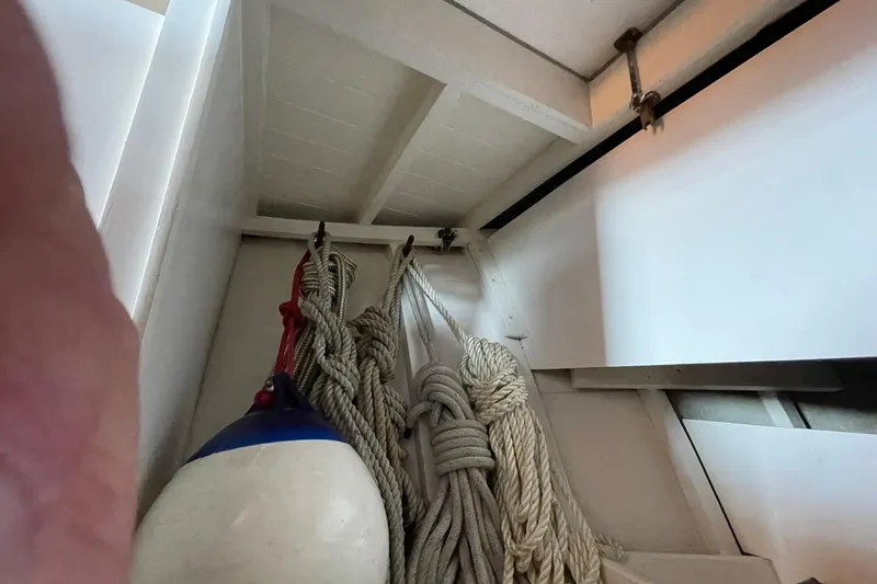 Slide: The Image of Coiled ropes and buoy inside 1939 Richardson 26 Little Giant boat. - 13